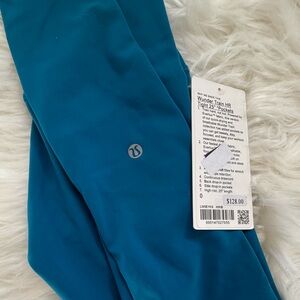 Teal LULULEMON Wunder Train HR Tight 25” *pockets, leggings